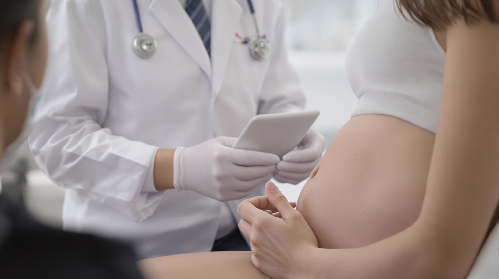 Pregnant woman consulting with a doctor